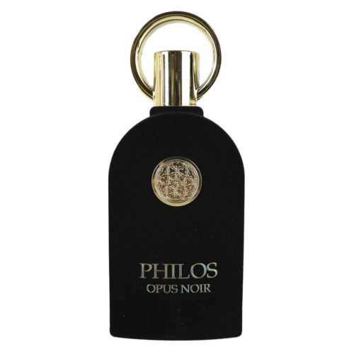 A black, velvet-textured perfume bottle of Philos Opus Noir by Maison Alhambra, featuring a gold circular ornament and a golden cap with a ring handle.