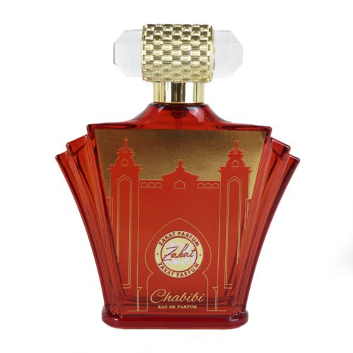 Close-up of the Zakat Parfum Chabibi perfume bottle, featuring a striking red and gold architectural design with a textured gold cap.