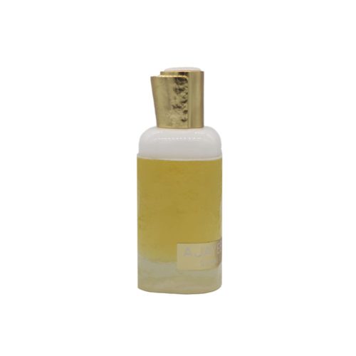 Close-up of the Ajayeb Dubai Portrait perfume bottle with a soft golden-yellow tone and white top.