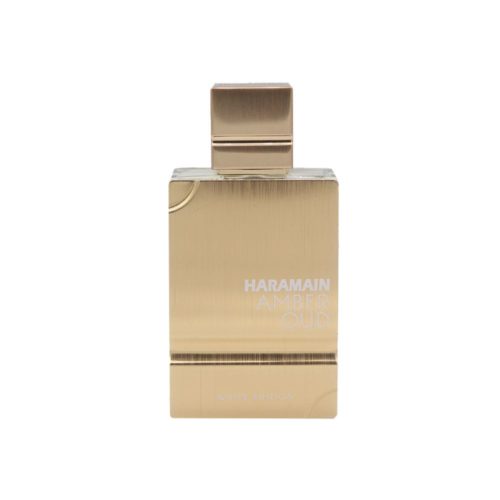 Close-up of the Amber Oud White Edition perfume bottle with golden cap and engraved label.