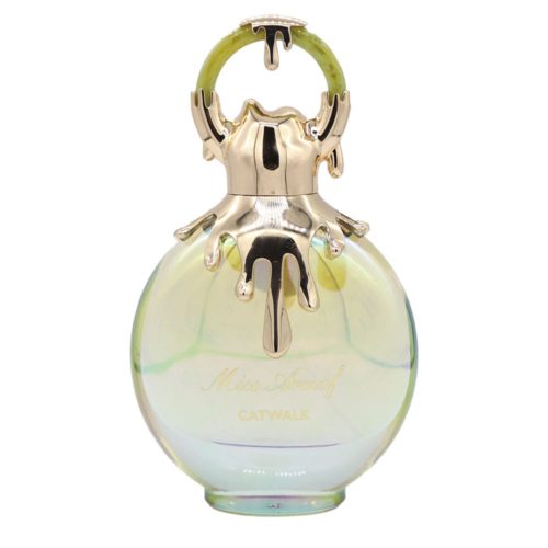 Close-up of the Miss Armaf Catwalk perfume bottle with golden dripping cap design and green top ring.