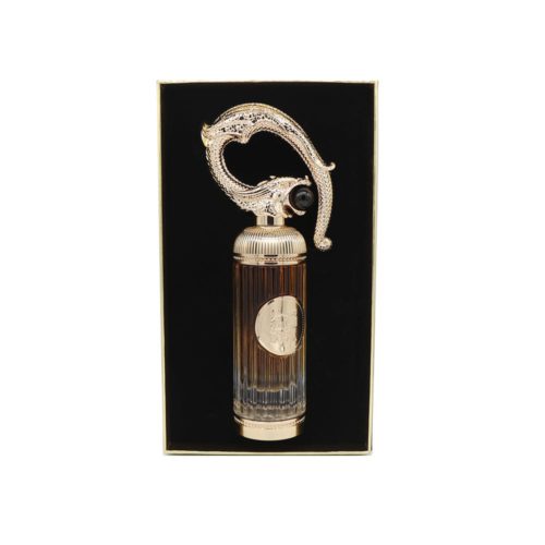 Close-up of the Pride Sehr perfume bottle by Lattafa, nestled in a black velvet display.