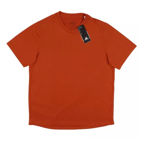 Orange Adidas short sleeve Creator Tee with round neck and visible tag on collar.